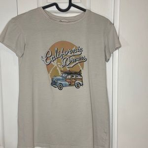 White t-shirt with design on it.